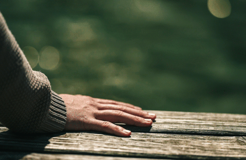 hand-with-moving-water
